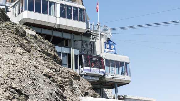 The Schilthornbahn cable car on the way to the summit, pictured on August 6, 2013, on Mount Schilthorn in Muerren, Switzerland. Mount Schilthorn with the revolving restaurant Piz Gloria was a filming  ...