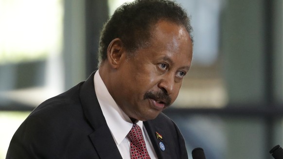 FILE - Sudanese Prime Minister Abdalla Hamdok speaks during a session of the summit to support Sudan, at the Grand Palais Ephemere in Paris on May 17, 2021. On Sunday, Jan. 2, 2021, Hamdok announced h ...