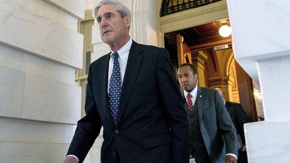 FILE - In this June 21, 2017, file photo, former FBI Director Robert Mueller, the special counsel probing Russian interference in the 2016 election, departs Capitol Hill following a closed door meetin ...