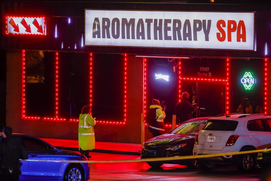 epa09078995 Atlanta Police Department officers investigate the scene of a shooting outside a spa on Piedmont Road in Atlanta, Georgia, USA, 16 March 2021. At least eight people were reported dead foll ...