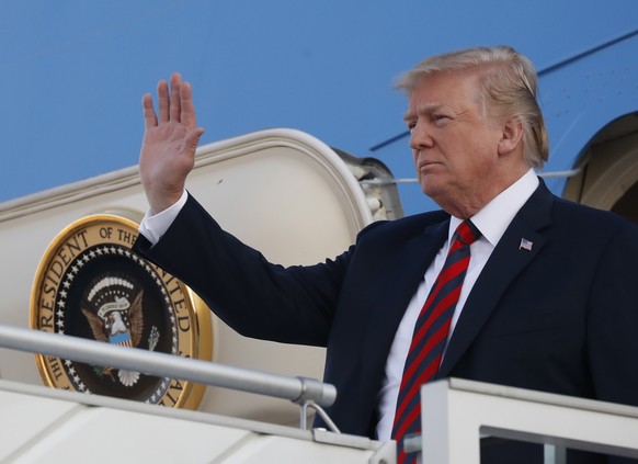 U.S. President Donald Trump waves as he arrives at the airport in Helsinki, Finland, Sunday, July 15, 2018 on the eve of his meeting with Russian President Vladimir Putin. (AP Photo/Pablo Martinez Mon ...