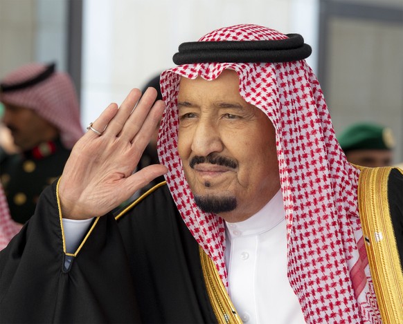 epa07177245 A handout photo made available by the Saudi Royal Palace shows Saudi King Salman bin Abdulaziz Al Saud saluting upon arrival to inaugurate the Shura Council new session, in Riyadh, Saudi A ...