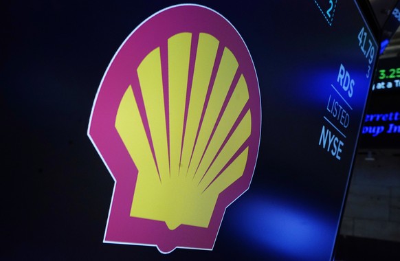 FILE - The logo for Royal Dutch Shell appears above a trading post on the floor of the New York Stock Exchange, on Dec. 1, 2021. Royal Dutch Shell investors are expected to change the company