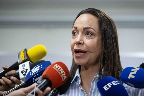 epa11413456 Former deputy Maria Corina Machado speaks during a press conference in Caracas, Venezuela, 15 June 2024. The Vente Venezuela (VV) party, led by opposition member María Corina Machado, deno ...