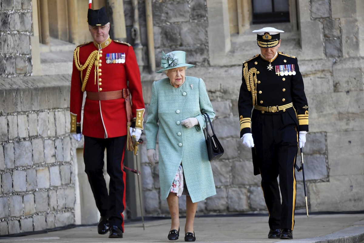 Britain's Queen Elizabeth II walks during a ceremony to mark her official birthday at Windsor Castle in Windsor, England, Saturday June 13, 2020. Queen Elizabeth II���s birthday is being marked w ...