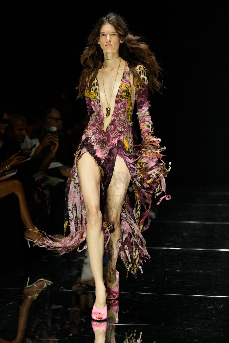 A model wears a creation part of the Roberto Cavalli women's Spring-Summer 2027 collection, presented in Milan, Italy, Thursday, Sept. 24, 2026. (AP Photo/Luca Bruno).
Italy Fashion Roberto Caval ...