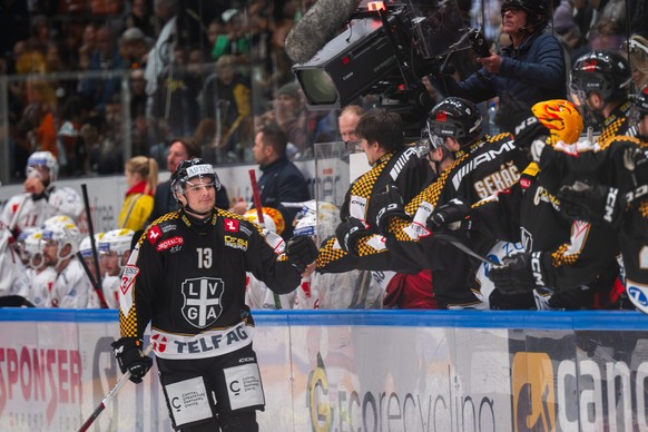 Matthew Verboon (HCL) left, celebrate the 2 - 0 goal with team mate, during the regular season of National League A (NLA) Swiss Championship 2024/25 between HC HC Lugano and SC Rapperswil Jona Lakers  ...
