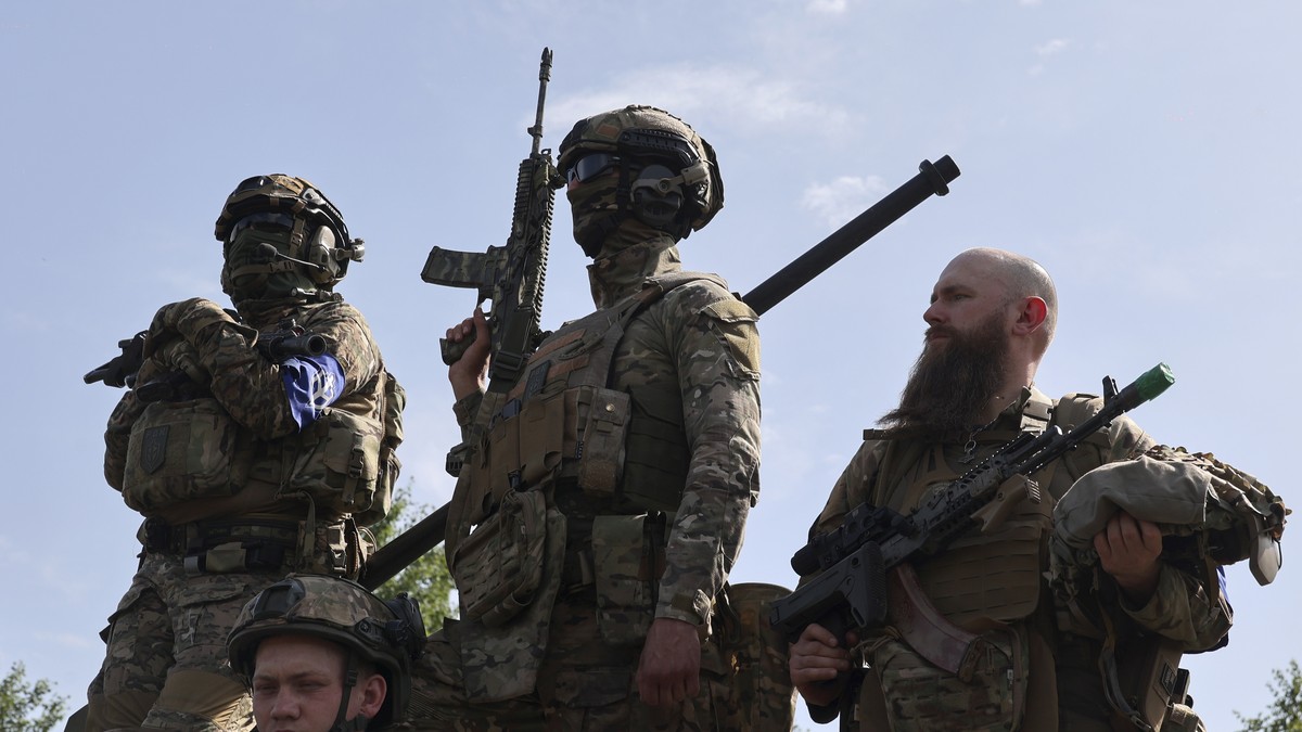 epa10650556 Members of the 'Russian Volunteer Corps' and 'Freedom of Russia Legion' hold a meeting with the media not far from the Ukraine-Russia border in Kharkiv's area, nor ...
