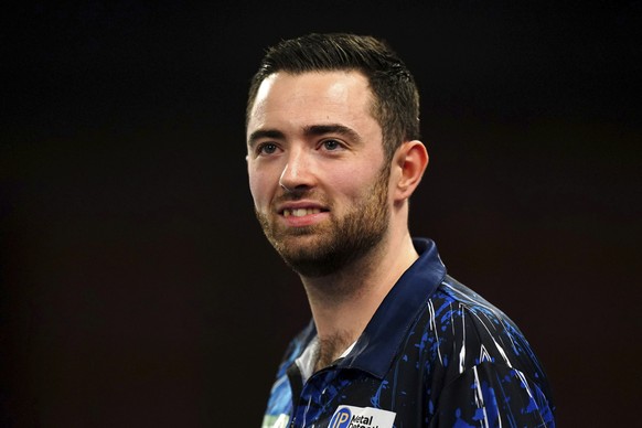 Luke Humphries in action against Lee Evans, not pictured, on Day 3 of the World Darts Championship at Alexandra Palace, in London, Sunday, Dec. 17, 2023. (Zac Goodwin/PA via AP)
Luke Humphries