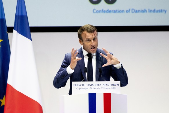 epa06980614 French president Emmanuel Macron delivers a speech at the French-Danish Business Forum at the Confederation of Danish Industri in Copenhagen, Denmark, 29 August 2018. The French president  ...