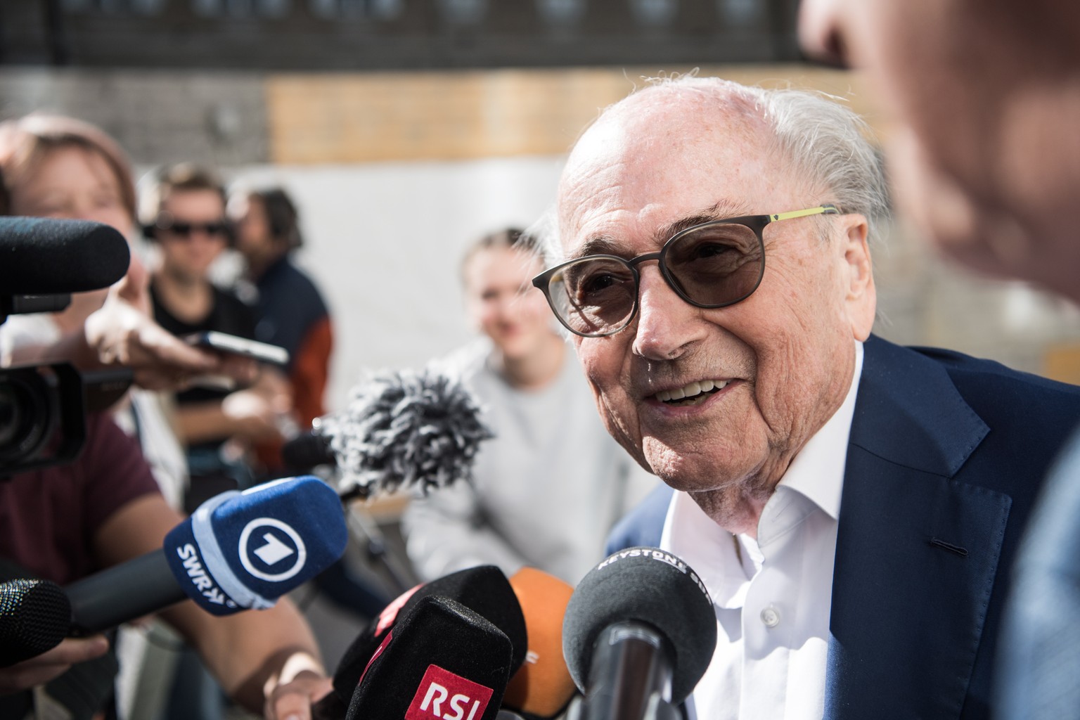 epa10058658 The former president of the World Football Association (FIFA), Joseph Blatter, is surrounded by media representatives, as he gives statements at the last day of his trial, when the verdict ...