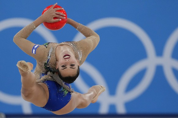 Linoy Ashram, of Israel, performs during the rhythmic gymnastics individual all-around final at the 2020 Summer Olympics, Saturday, Aug. 7, 2021, in Tokyo, Japan. (AP Photo/Ashley Landis)