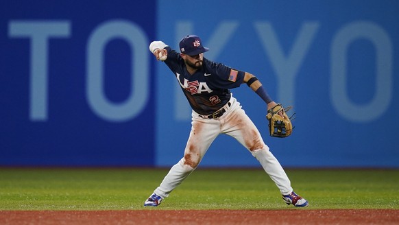 United States&#039; Eddy Alvarez fields a ground out by Japan&#039;s Hayato Sakamoto during the gold medal baseball game at the 2020 Summer Olympics, Saturday, Aug. 7, 2021, in Yokohama, Japan. (AP Ph ...