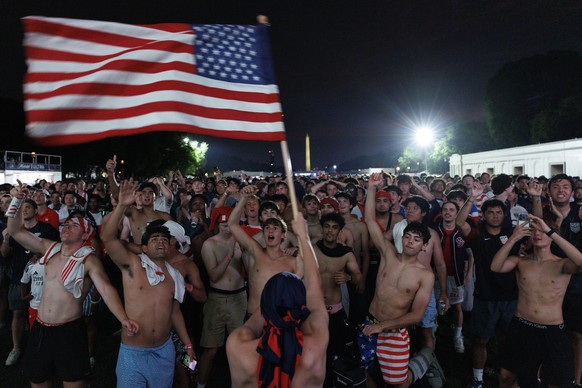 epaselect epa13033772 USA fans watch the USA vs Paraguay soccer match at a World Cup 2026 Fan Zone on the National Mall in Washington, DC, USA, 12 June 2026. The FIFA World Cup 2026 will run from 11 J ...