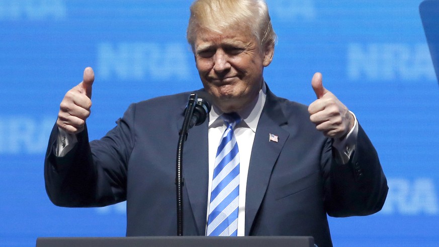 President Donald Trump gestures from the podium as as speaks at the National Rifle Association-Institute for Legislative Action Leadership Forum in Dallas, Friday, May 4, 2018. (AP Photo/Sue Ogrocki)