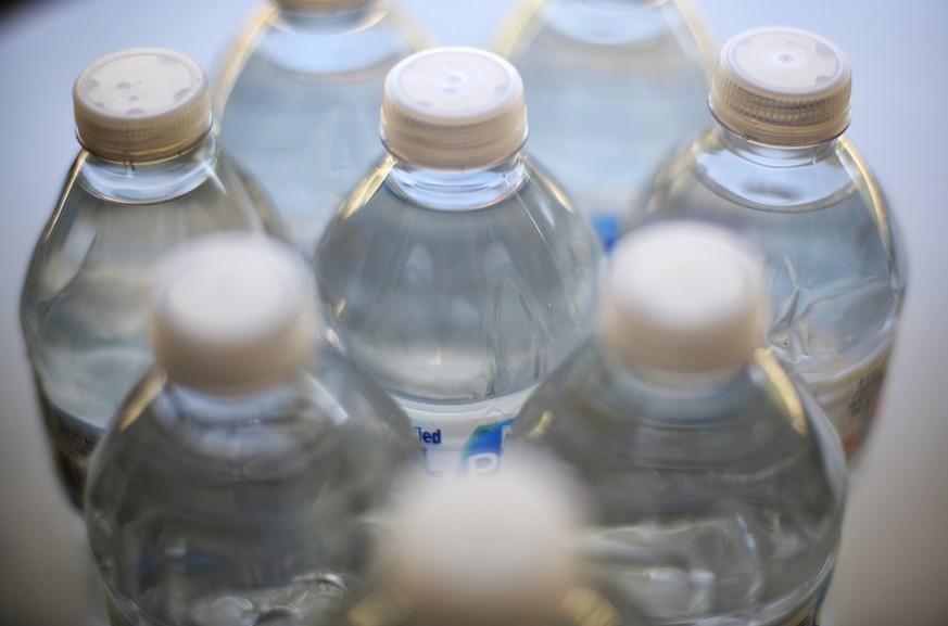Drinking water is seen on a cafeteria table in Los Angeles on Friday, Aug. 2, 2109. In northern California, San Francisco International Airport is banning the sale of single-use plastic water bottles. ...