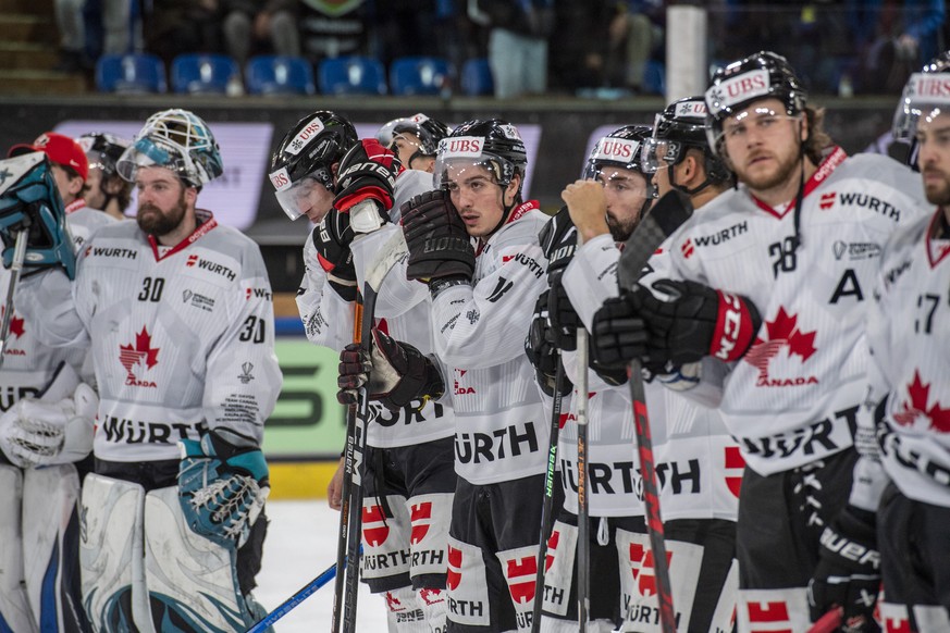 The players from Canada reacting after the game the game between HC Dynamo Pardubice from Czech Republic and Team Canada at the 95th Spengler Cup ice hockey tournament in Davos, Switzerland, on Saturd ...