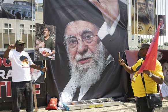 epa12801369 Protestors from various civil organizations gather outside the United States Consulate in Johannesburg, South Africa, 07 March 2026, in support of Iran in the ongoing conflict in the Middl ...