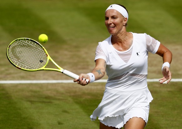 epa06069633 Svetlana Kuznetsova of Russia in action against Ekaterina Makarova of Russia during their second round match for the Wimbledon Championships at the All England Lawn Tennis Club, in London, ...