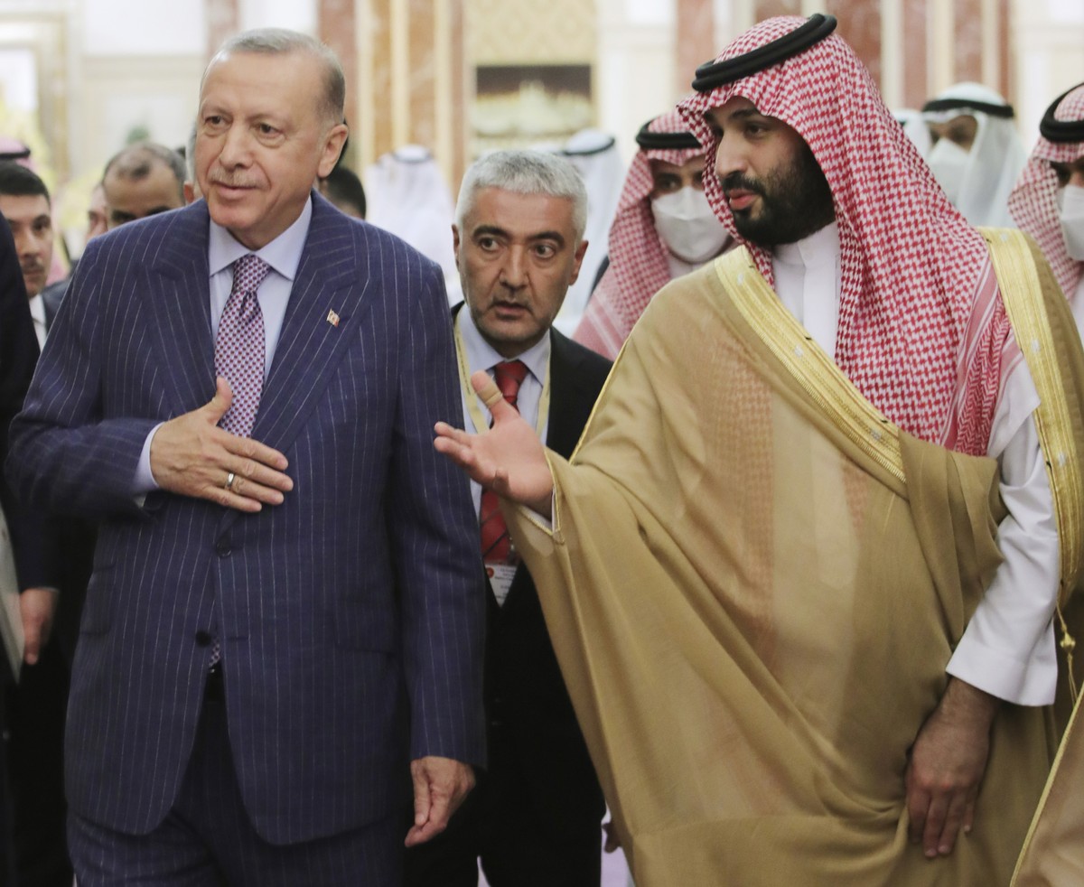 In this photo made available by the Turkish Presidency, Turkish President Recep Tayyip Erdogan, left, and Saudi Arabia's Crown Prince Mohammed bin Salman speak before a meeting in Jiddah, Saudi A ...
