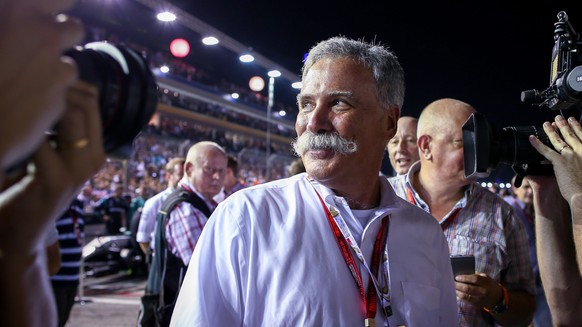 epa05746256 (FILE) - Chase Carey, F1 chairman, walks on the track before the start of the Singapore Formula One Grand Prix night race in Singapore, 18 September 2016. Carey will replace Bernie Ecclest ...