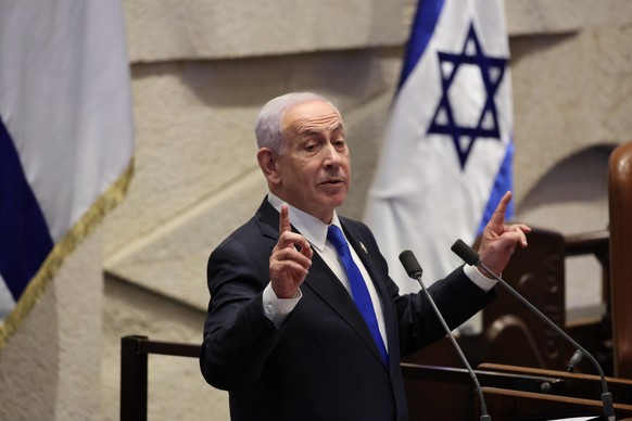 epa12579008 Israeli Prime Minister Benjamin Netanyahu delivers a speech during a plenary session of the Knesset, the Israeli parliament, in Jerusalem, 08 December 2025. The session included a 40-signa ...