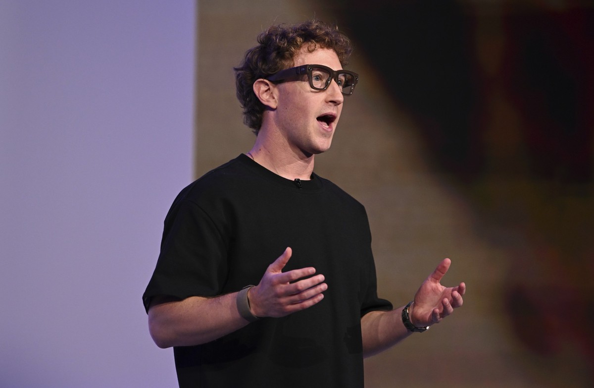Meta CEO Mark Zuckerberg wears artificial intelligence-powered smart glasses and a wristband as he speaks during the company's Connect developer conference Wednesday, Sept. 17, 2025, in Menlo Par ...