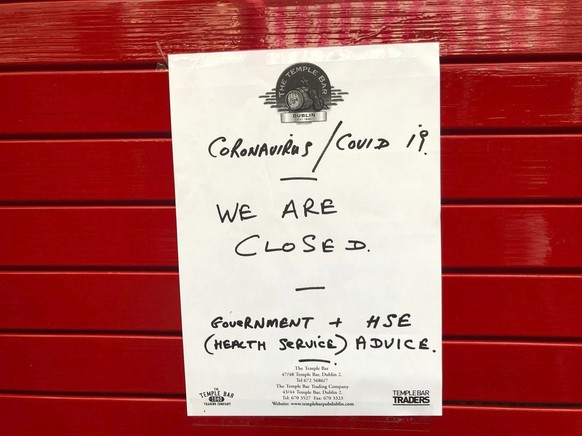 A sign on the door of The Temple Bar, as pubs and clubs in Irish tourist hotspot Temple Bar closed with immediate effect amid coronavirus fears, in Dublin, Ireland, Sunday March 15, 2020. For most peo ...