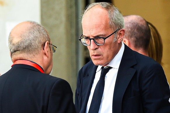 epa07772790 Genoa public prosecutor Francesco Cozzi (R) after an official ceremony on the first anniversary of the Morandi highway bridge collapse, in Genoa, northern Italy, 14 August 2019. The motorw ...