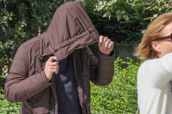 epa10655127 One of the 18 defendants arrives for the court judgment in the trial for the death of student Sanda Dia, at the Court of Appeal in Antwerp, Belgium, 26 May 2023. A court in Belgium sentenc ...