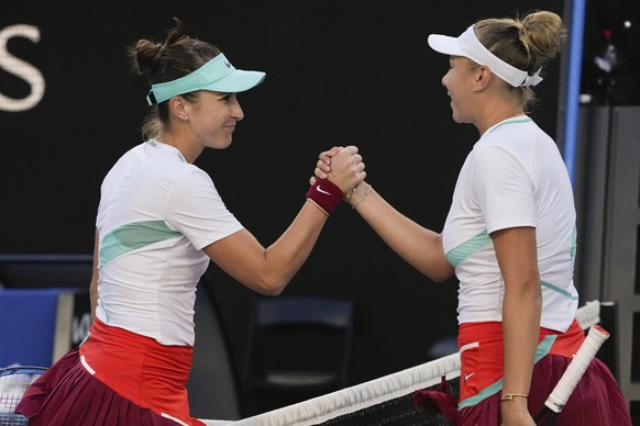 Amanda Anisimova, right, of the U.S. is congratulated by Belinda Bencic of Switzerland after winning their second round match at the Australian Open tennis championships in Melbourne, Australia, Wedne ...