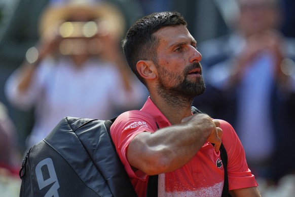 Novak Djokovic of Serbia leaves the court after losing against Matteo Arnaldi of Italy during the Madrid Open tennis tournament in Madrid, Spain, Saturday, April 26, 2025. (AP Photo/Manu Fernandez)
Sp ...