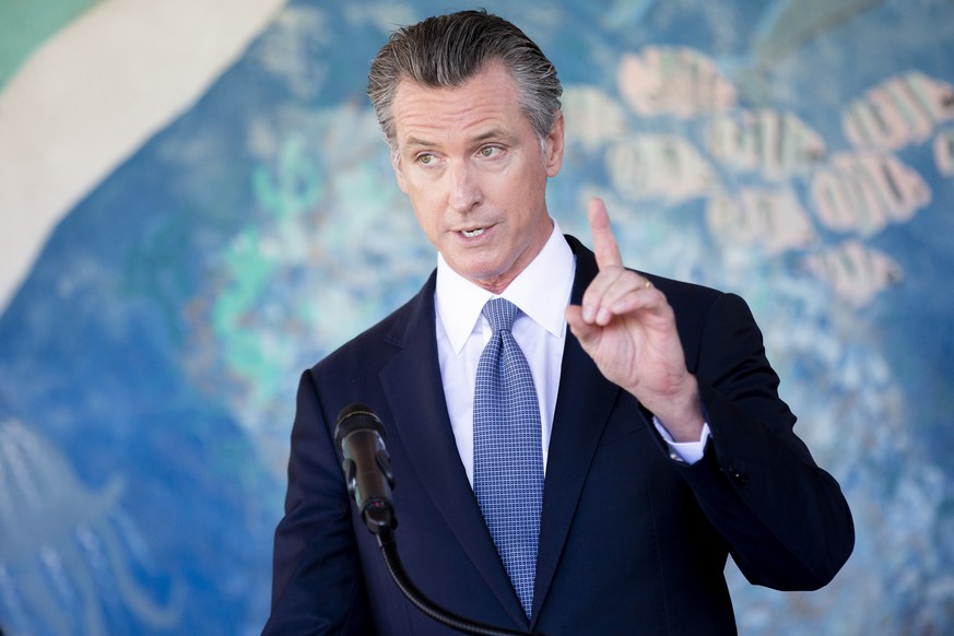 California Gov. Gavin Newsom speaks during a news conference at Carl B. Munck Elementary School, Wednesday, Aug. 11, 2021, in Oakland, Calif. Gov. Newsom announced that California will require its 320 ...