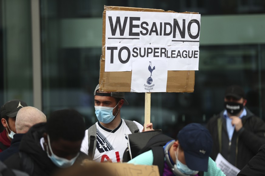 Tottenham fans stage a protest against the Board over the planned creation of a European Super League, outside the Tottenham Hotspur Stadium in London, England, Wednesday, April 21, 2021. Over two fra ...