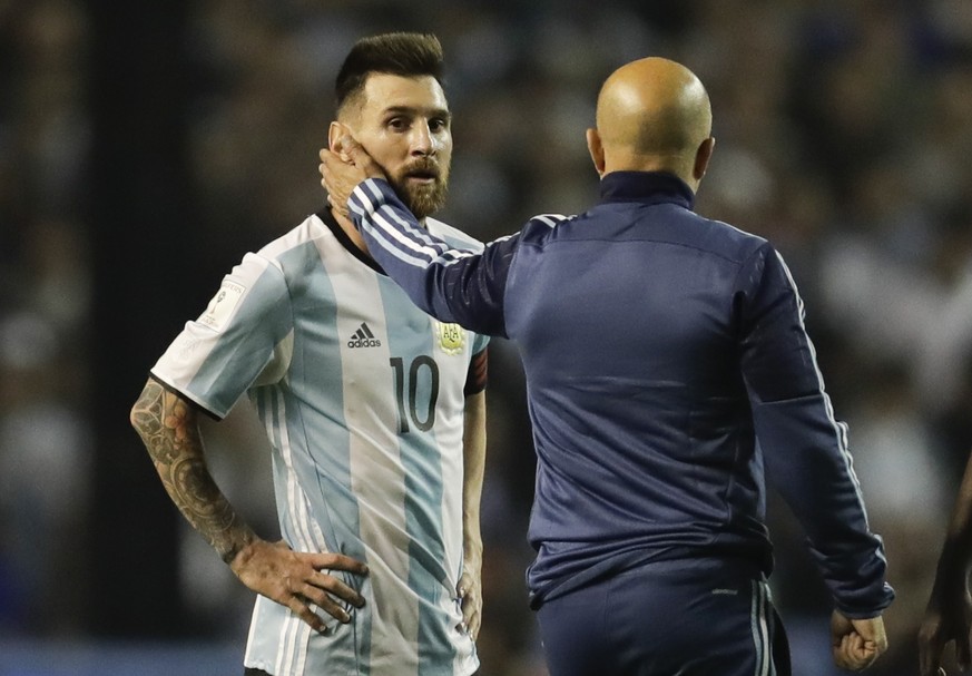 Argentina&#039;s Lionel Messi, left, is comforted by Argentina coach Jorge Sampaoli after a World Cup qualifying soccer match at La Bombonera stadium in Buenos Aires, Argentina, Thursday, Oct. 5, 2017 ...