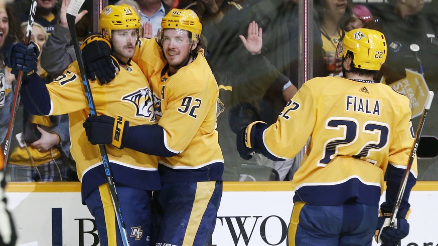 Nashville Predators left wing Austin Watson (51) celebrates with Ryan Johansen (92) and Kevin Fiala (22), of Switzerland, after scoring against the Anaheim Ducks during the second period of an NHL hoc ...