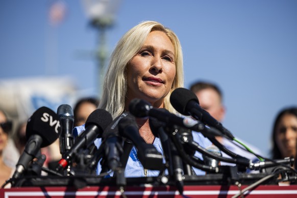 epa12349611 US Republican Representative from Georgia Marjorie Taylor Greene speaks at a press conference with survivors of the Jeffrey Epstein and Ghislaine Maxwell sex-trafficking scandal outside th ...