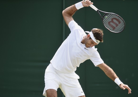 epa06069929 Juan Martin Del Potro of Argentina in action against Ernests Gulbis of Latvia during their second round match for the Wimbledon Championships at the All England Lawn Tennis Club, in London ...