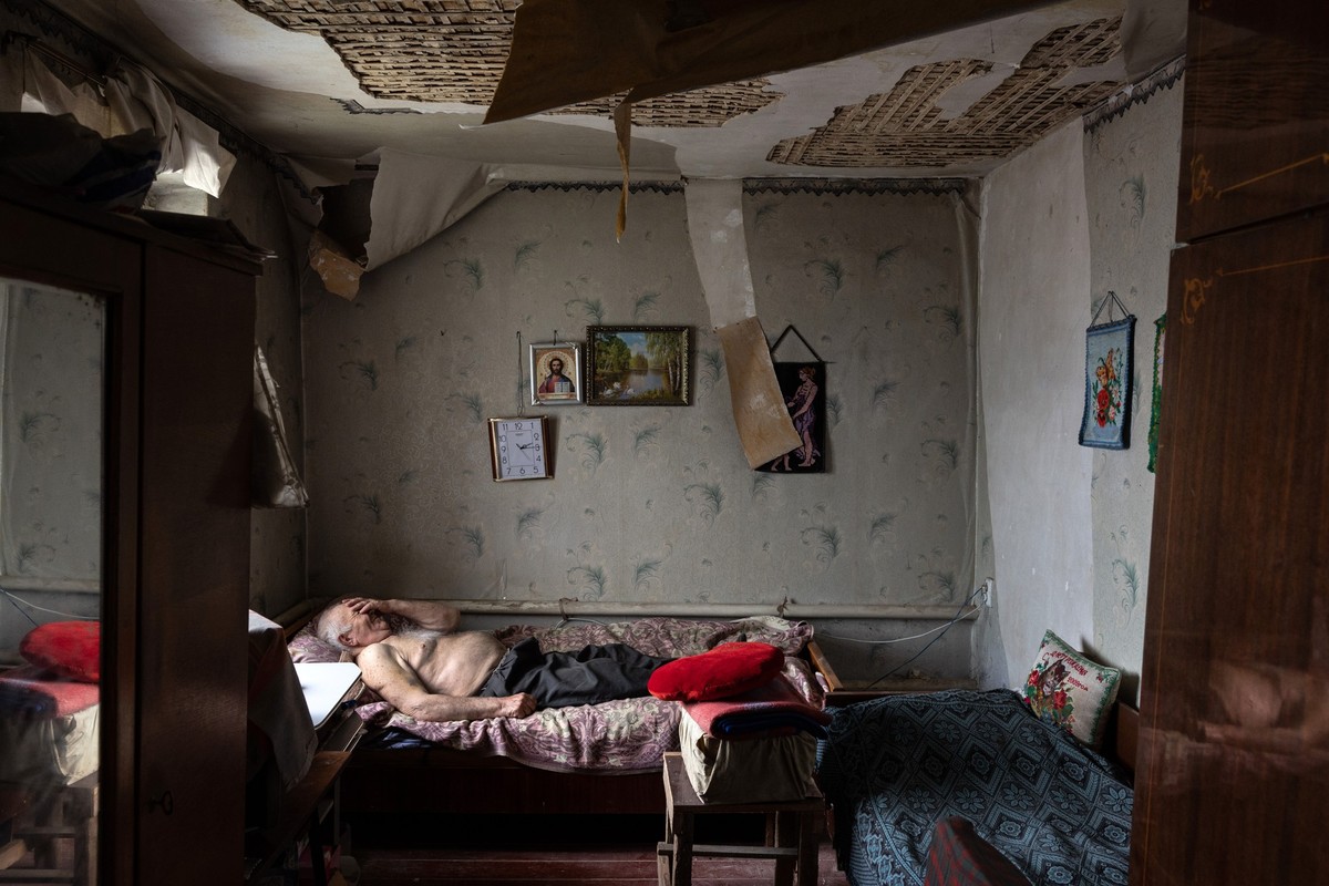 VILKHIVKA, UKRAINE- MAY 18: Olexiy Pshenychnykh, 85, rests in his war-damaged home to the east of Kharkiv on May 18, 2022 in Vilkhivka, Ukraine, which had until recently been occupied by Russian force ...