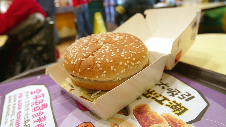 Hong Kong, CHINA: A big mac lays on a table waiting to be consumed at a Mcdonalds restraurant in Hong Kong, 20 February 2006. Big Macs in Hong Kong contain more fat and cholesterol than those being se ...