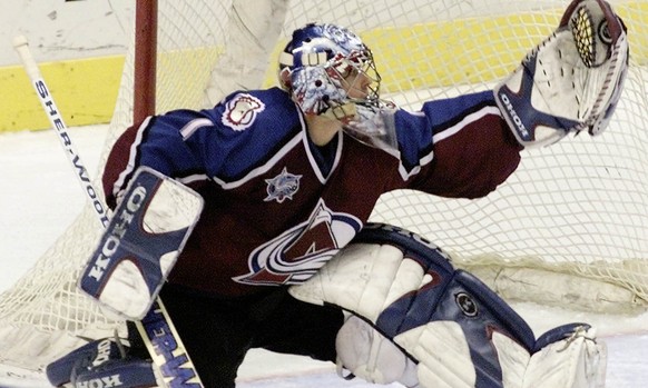 Colorado Avalanche goalie David Aebischer makes a glove save on a slap shot from St. Louis Blues&#039; Al MacInnis in the second period Thursday, March 22, 2001, at the Savvis Center in St. Louis. (KE ...