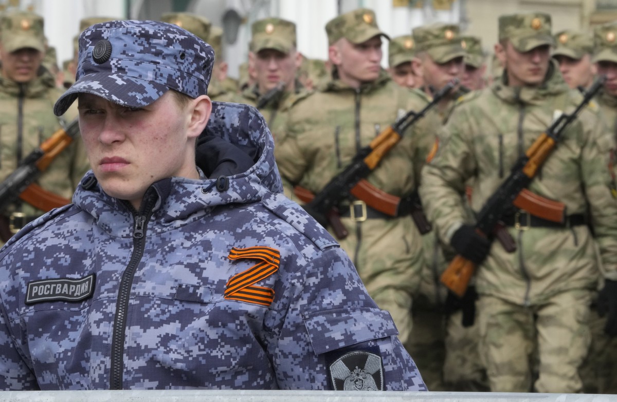 A soldier of Russian Rosguardia (National Guard) with an attached letter Z, which has become a symbol of the Russian military, stands guard during a rehearsal for the Victory Day military parade which ...