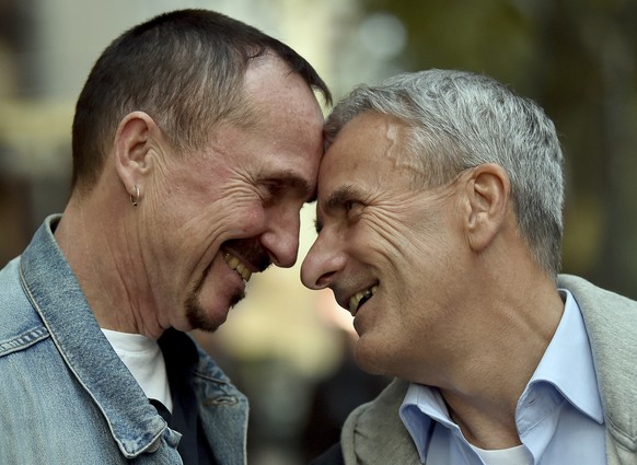 In this Sept. 27, 2017 photo Karl Kreile, left, and Bodo Mende are looking into each others eyes in Berlin, Germany. Almost forty years after their first kiss, Karl and Bodo are getting hitched. The t ...