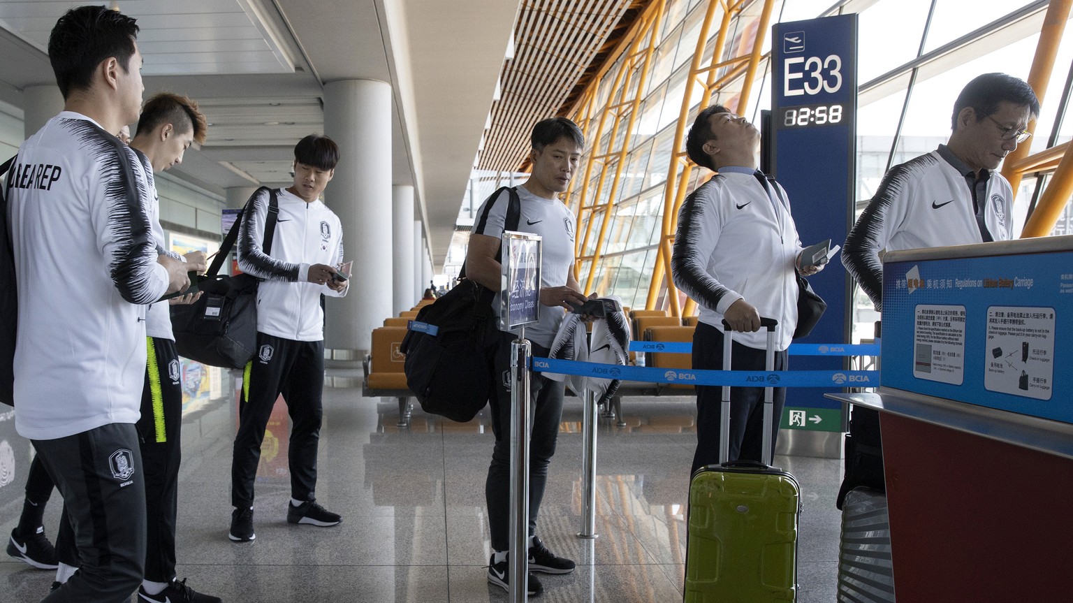 Members of the South Korean football team prepare to board an Air China flight to Pyongyang for a World Cup qualifier match against North Korea, from the airport in Beijing on Monday, Oct. 14, 2019. ( ...