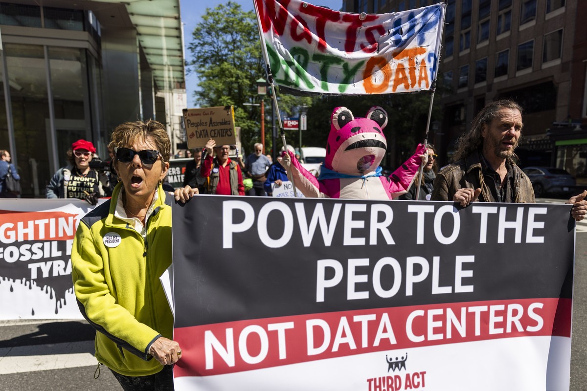 epa12905104 Activists protest the environmental consequences of data center expansion outside a data center conference in Washington, DC, USA, 21 April 2026. Activists equated the centers, which are i ...