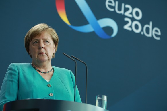 epa08523343 German Chancellor Angela Merkel speaks at a media conference in Berlin, 02 July 2020. Germany took over the rotating European Council Presidency for half a year on 01 July. European Commis ...