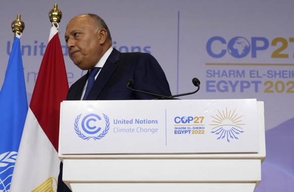 Sameh Shoukry, president of the COP27 climate summit, leaves after speaking at the summit, Saturday, Nov. 19, 2022, in Sharm el-Sheikh, Egypt. (AP Photo/Peter Dejong)