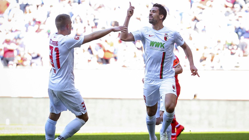 Augsburg&#039;s Rani Khedira celebrates after scoring his side&#039;s opening goal during the German Bundesliga soccer match between FC Augsburg and VfB Stuttgart in Augsburg, Germany, Saturday, April ...