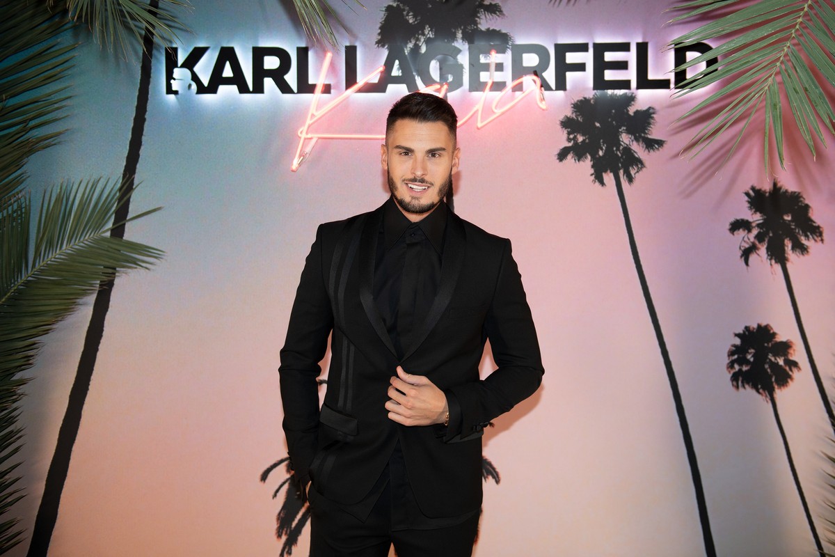 epa07065246 French model and singer Baptiste Giabiconi celebrates the launch of the Karl x Kaia collaboration capsule collection during the Paris Fashion Week, in Paris, France, 02 October 2018. The p ...