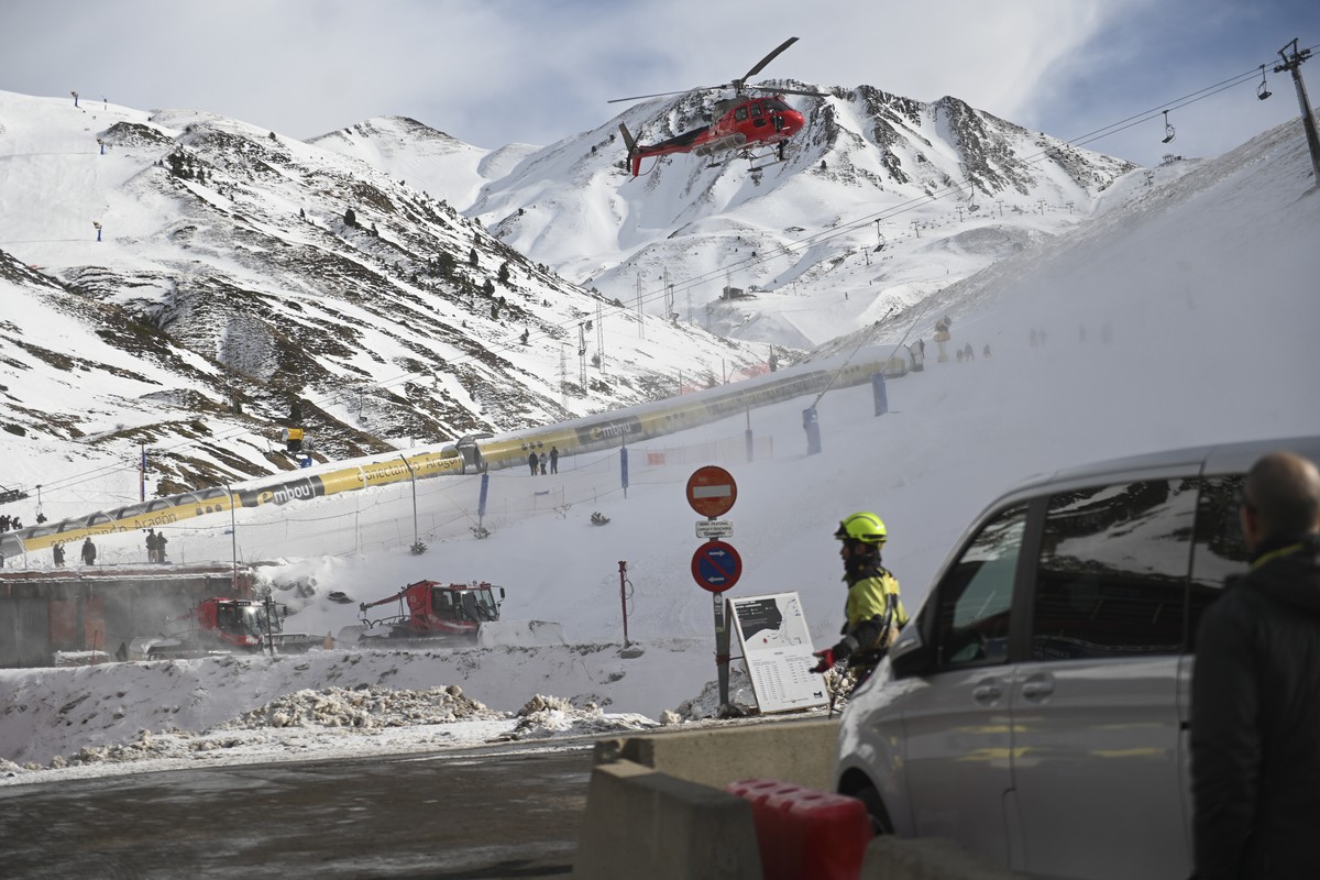 An emergency helicopter flies over the ski lifts at the Astum ski resort in Huesca, Spain, northern Spain on Saturday, Jan 18, 2025, where several people have been injured. (Ver�nica Lacasa/Europa Pre ...